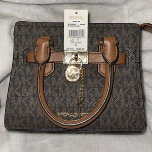 I am selling this lovely xs brown and gold crossbody bag.